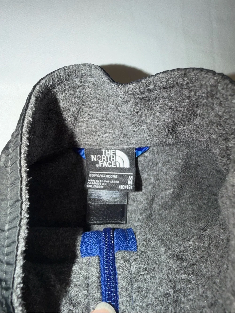 The North Face Kids Black and Gray Jacket with Blue Zip. C13,EMP